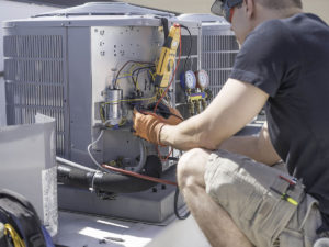a Repair USA technician servicing an HVAC unit